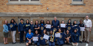 Governor with a group of students