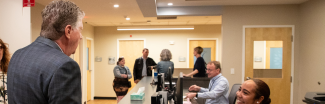 Governor speaking with a health care receptionist