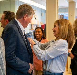 Governor McKee getting his suit adjusted