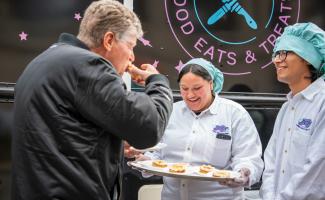 Governor McKee trying some pastries