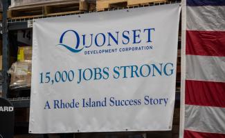 Quonset Development Corporation. 15000 Jobs Strong. A Rhode Island Success Story Sign